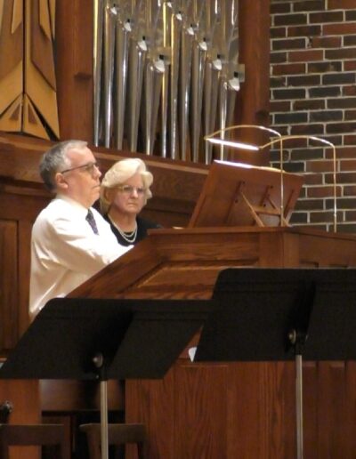 Andrew Walker playing on a pipe organ